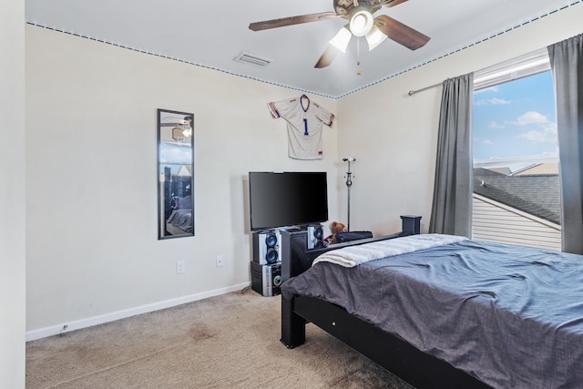 bedroom featuring light carpet and ceiling fan