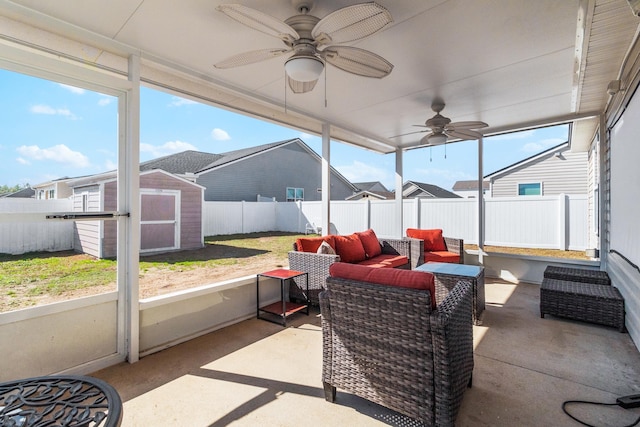 sunroom with plenty of natural light and ceiling fan