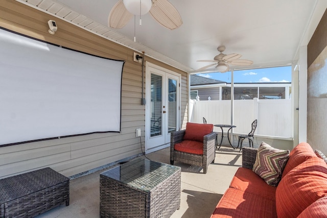 sunroom featuring ceiling fan