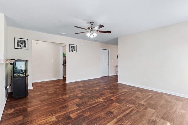 unfurnished living room with dark wood-type flooring and ceiling fan