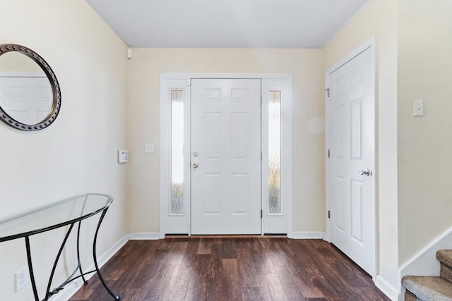 entrance foyer with dark hardwood / wood-style floors