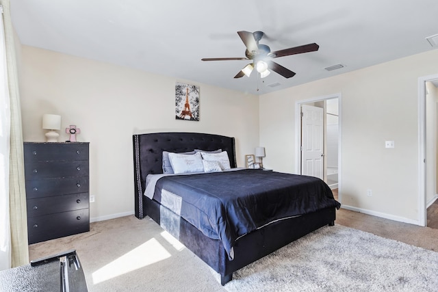 bedroom featuring light colored carpet and ceiling fan