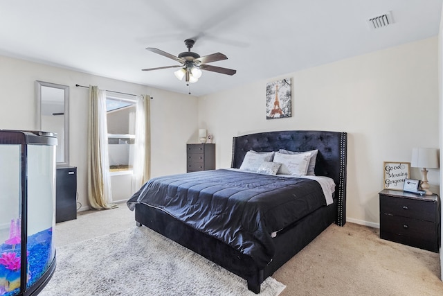 bedroom with light carpet and ceiling fan