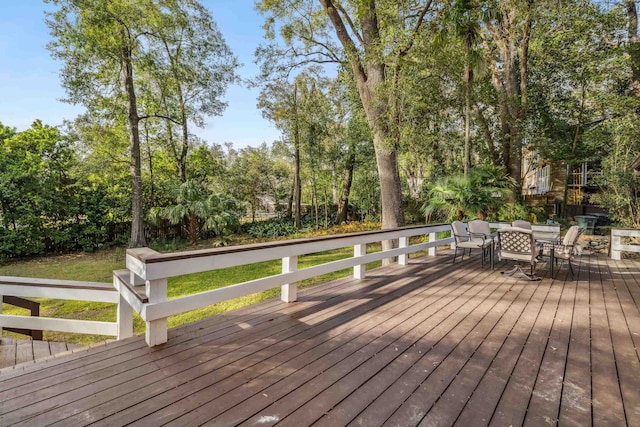 wooden deck featuring outdoor dining space