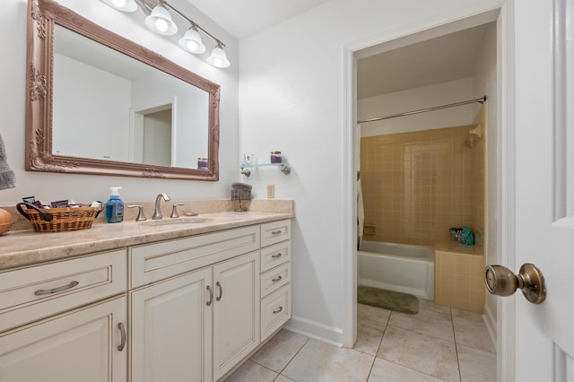 full bath featuring vanity, tile patterned floors, tub / shower combination, and baseboards