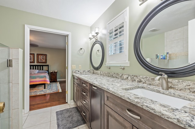full bathroom with tile patterned floors, an enclosed shower, a sink, connected bathroom, and double vanity