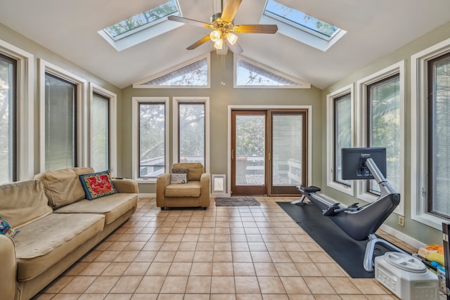 sunroom / solarium featuring vaulted ceiling with skylight and a ceiling fan