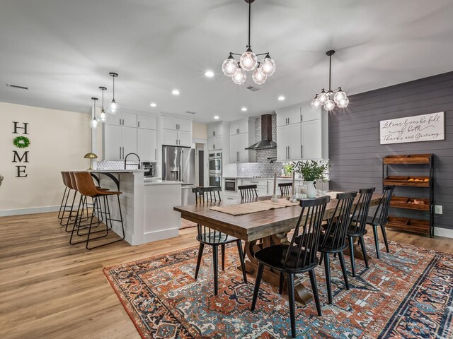 195 Coe Landing Rd, Tallahassee, FL 32310 - dining room featuring recessed lighting, a notable chandelier, visible vents, light wood-style flooring, and baseboards