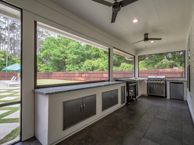 195 Coe Landing Rd, Tallahassee, FL 32310 - view of patio featuring a grill, an outdoor kitchen, ceiling fan, and a fenced backyard