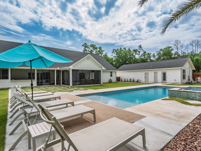 195 Coe Landing Rd, Tallahassee, FL 32310 - view of swimming pool featuring an outdoor structure, a patio, a sunroom, and a pool with connected hot tub