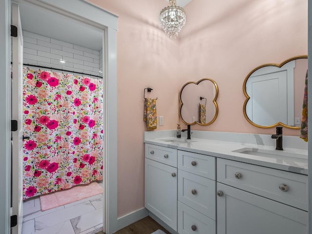 195 Coe Landing Rd, Tallahassee, FL 32310 - full bathroom featuring baseboards, tiled shower, double vanity, and a sink