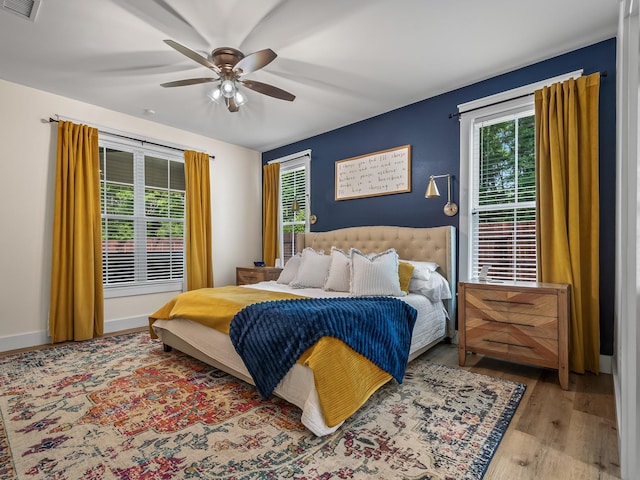 195 Coe Landing Rd, Tallahassee, FL 32310 - bedroom featuring baseboards, visible vents, wood finished floors, and a ceiling fan