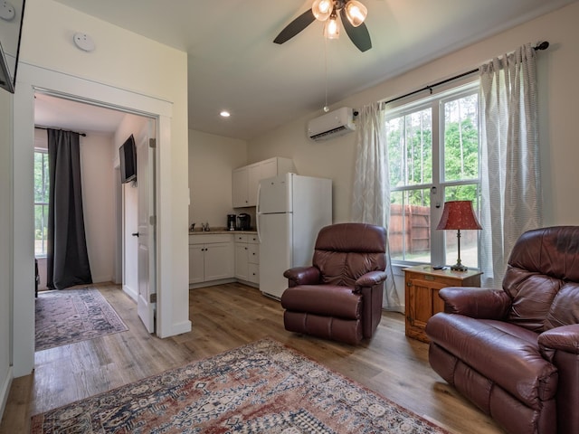 195 Coe Landing Rd, Tallahassee, FL 32310 - sitting room with light wood-style flooring, recessed lighting, ceiling fan, and a wall mounted AC