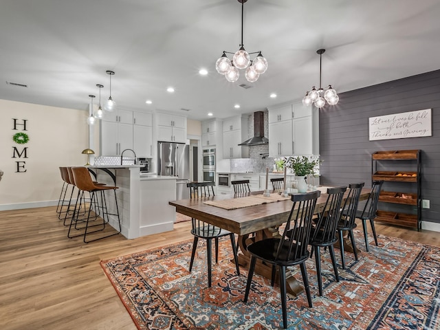195 Coe Landing Rd, Tallahassee, FL 32310 - dining room featuring recessed lighting, a notable chandelier, visible vents, light wood-style flooring, and baseboards