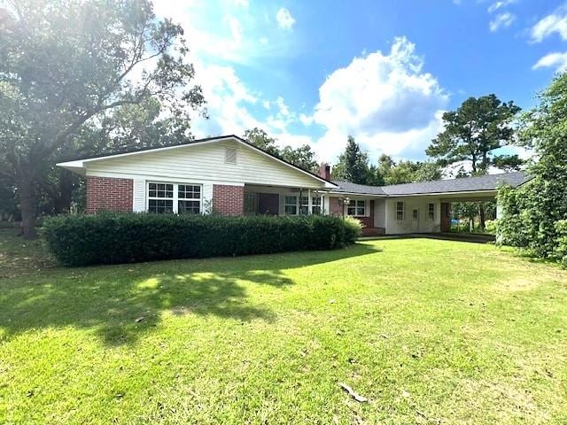 ranch-style house with a front lawn