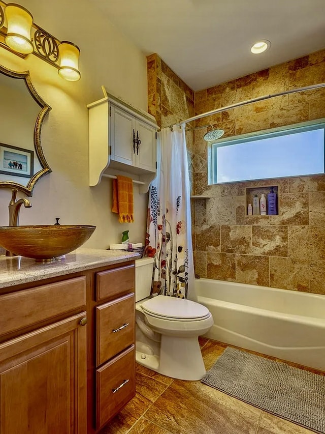 full bathroom featuring vanity, toilet, and shower / bath combo with shower curtain