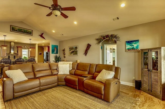 living room featuring vaulted ceiling and ceiling fan