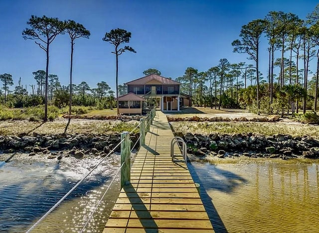 view of dock featuring a water view and a gazebo