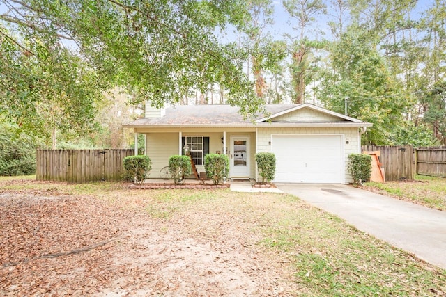 single story home featuring a garage and a porch