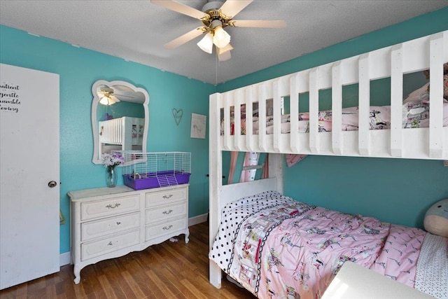 127 E Nancy St, Perry, FL 32347 - bedroom with wood finished floors, ceiling fan, and baseboards