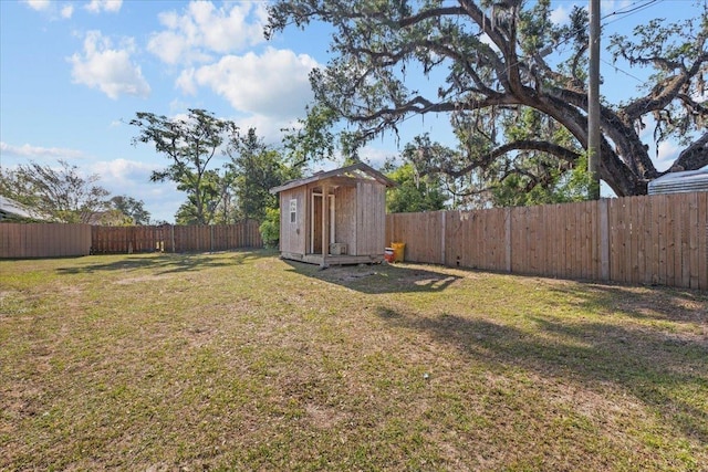 127 E Nancy St, Perry, FL 32347 - view of yard featuring a fenced backyard, an outbuilding, and a storage shed