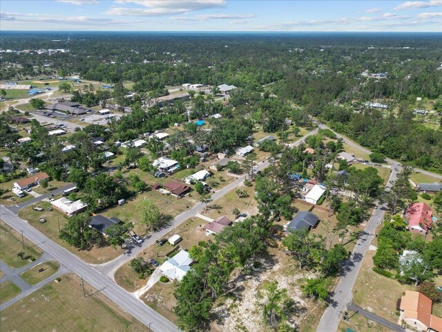 127 E Nancy St, Perry, FL 32347 - aerial view with a wooded view