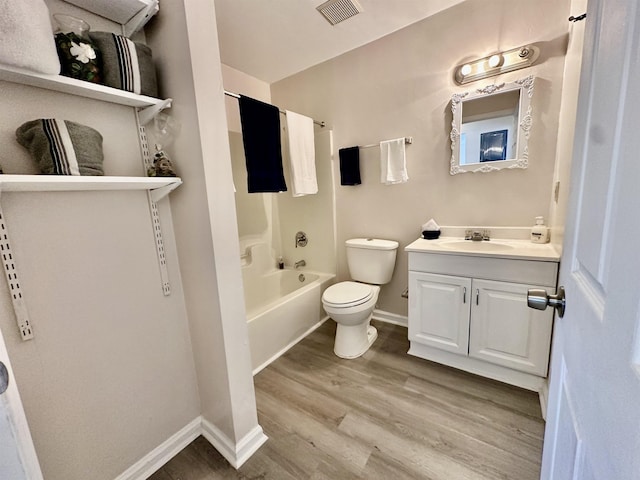 3180 N Ridge Rd -, Unit Tallahassee, FL 32305 - full bathroom with visible vents, vanity, wood finished floors, toilet, and baseboards