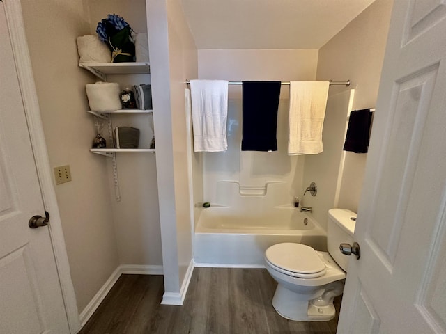 3180 N Ridge Rd -, Unit Tallahassee, FL 32305 - bathroom featuring washtub / shower combination, baseboards, toilet, and wood finished floors
