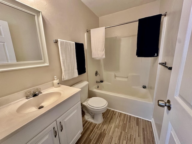 3180 N Ridge Rd -, Unit Tallahassee, FL 32305 - bathroom featuring vanity, toilet, wood finished floors, and shower / washtub combination