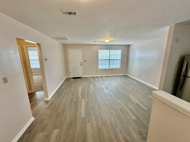 3180 N Ridge Rd -, Unit Tallahassee, FL 32305 - entrance foyer featuring visible vents, baseboards, and wood finished floors