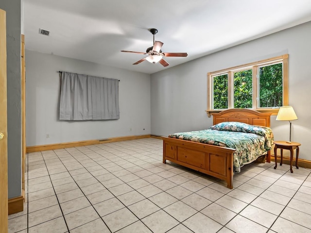 881 Hickory Hammock Rd, Carrabelle, FL 32322 - bedroom featuring baseboards, light tile patterned floors, and a ceiling fan