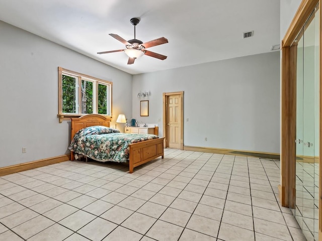 881 Hickory Hammock Rd, Carrabelle, FL 32322 - bedroom with baseboards, a ceiling fan, and light tile patterned flooring