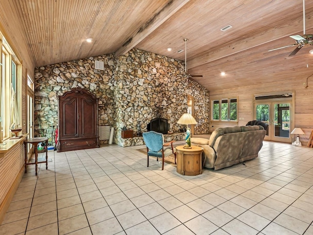 881 Hickory Hammock Rd, Carrabelle, FL 32322 - living area with ceiling fan, a fireplace, beamed ceiling, wooden ceiling, and light tile patterned floors