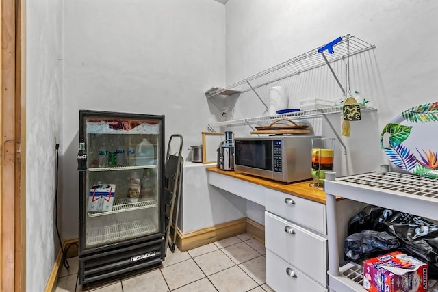 881 Hickory Hammock Rd, Carrabelle, FL 32322 - office area featuring built in study area, light tile patterned flooring, and baseboards