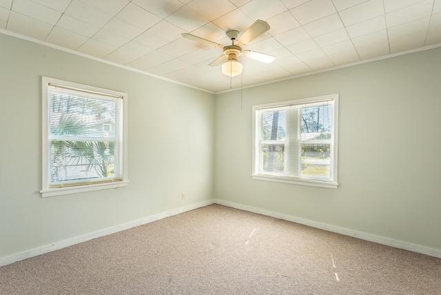 253 Prado St, Apalachicola, FL 32320 - carpeted spare room with ornamental molding, baseboards, and a ceiling fan