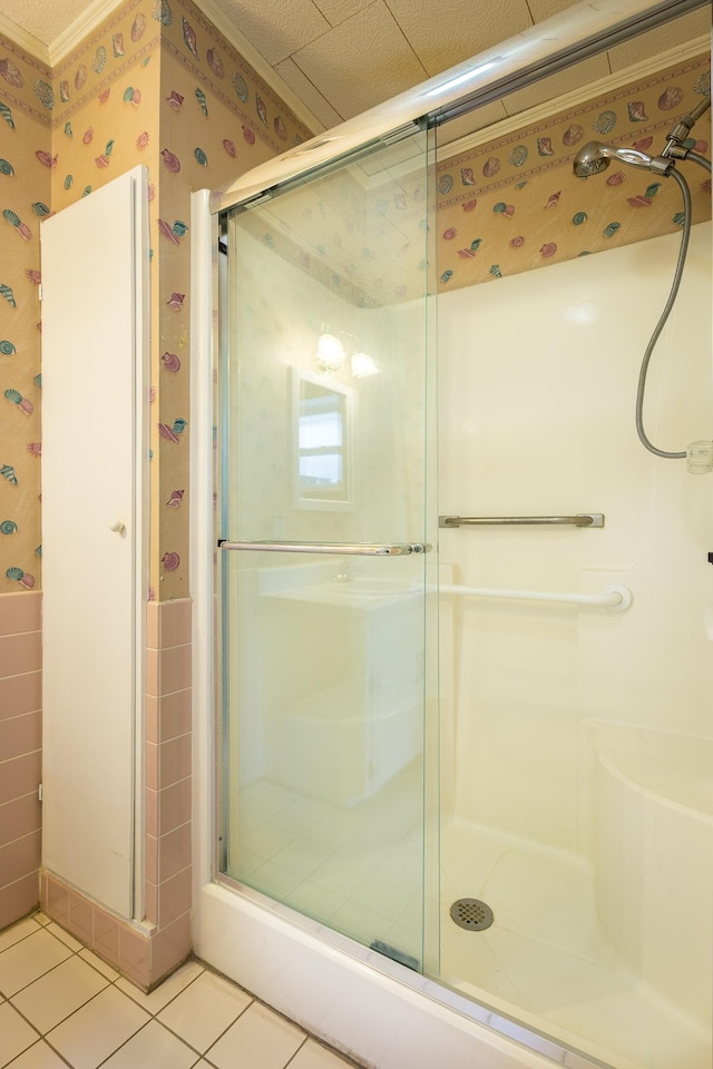 253 Prado St, Apalachicola, FL 32320 - full bathroom with wallpapered walls, a shower stall, and tile patterned flooring