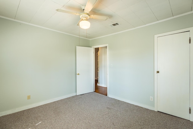 253 Prado St, Apalachicola, FL 32320 - unfurnished room with crown molding, carpet flooring, ceiling fan, and baseboards