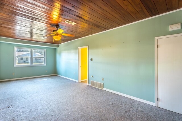253 Prado St, Apalachicola, FL 32320 - unfurnished room with wood ceiling, ornamental molding, carpet, a ceiling fan, and baseboards