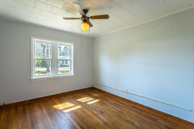 253 Prado St, Apalachicola, FL 32320 - spare room with hardwood / wood-style floors, crown molding, ceiling fan, and baseboards