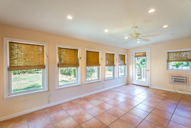 253 Prado St, Apalachicola, FL 32320 - empty room with a ceiling fan, recessed lighting, baseboards, a wall mounted AC, and light tile patterned floors