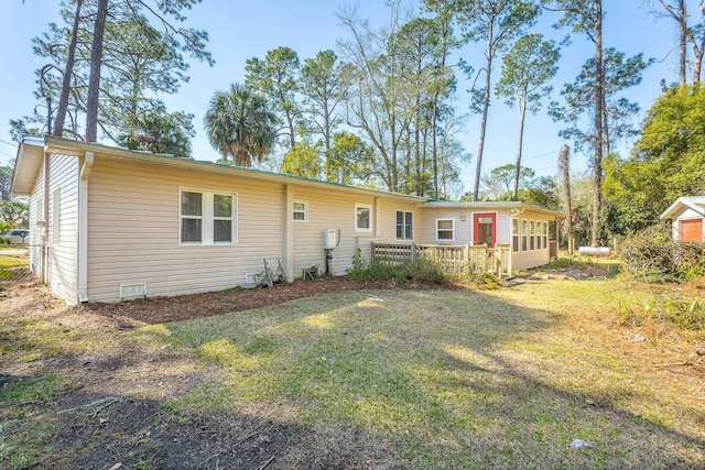 253 Prado St, Apalachicola, FL 32320 - back of house with a lawn and a deck