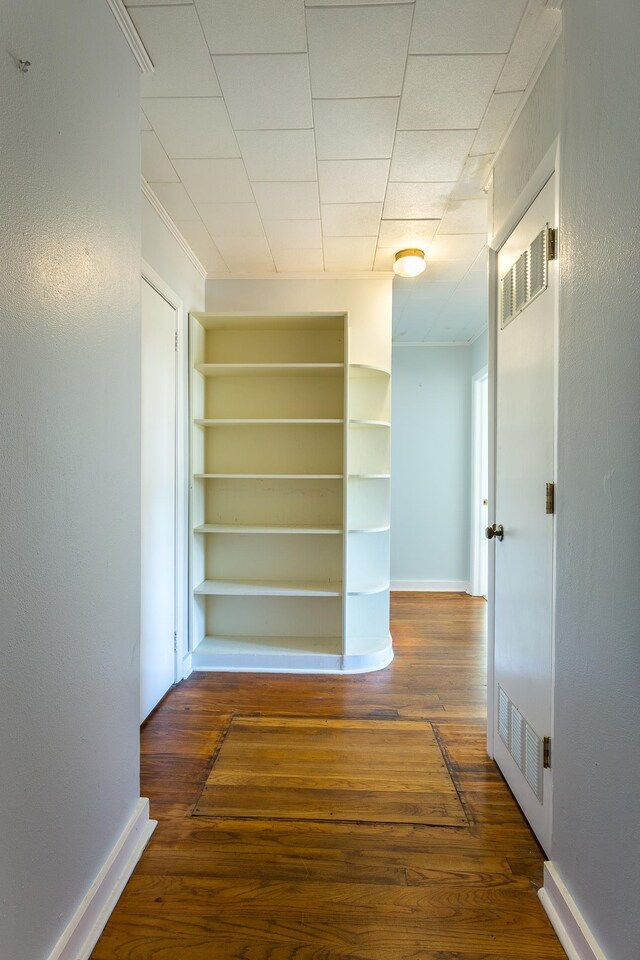 253 Prado St, Apalachicola, FL 32320 - hallway with wood-type flooring, baseboards, and crown molding