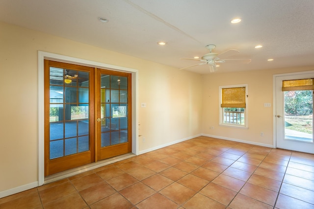 253 Prado St, Apalachicola, FL 32320 - empty room featuring ceiling fan, recessed lighting, light tile patterned flooring, and baseboards