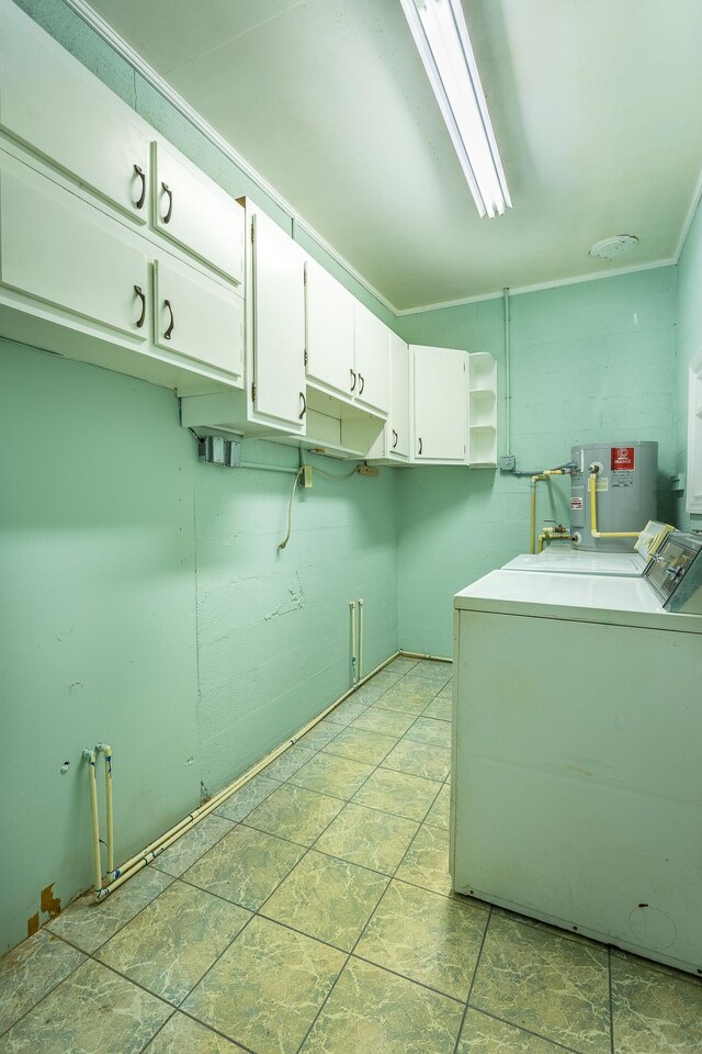 253 Prado St, Apalachicola, FL 32320 - washroom with cabinet space, washer and dryer, and water heater