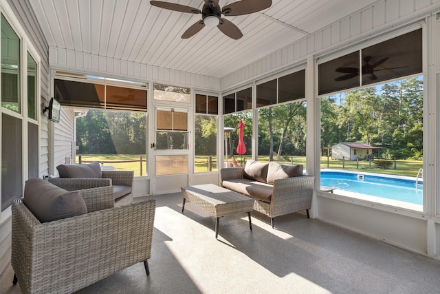 1094 Paul Thompson Rd, Monticello, FL 32344 - sunroom / solarium featuring a ceiling fan, an outdoor hangout area, and view of wooded area