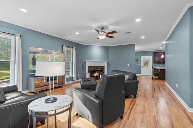 1094 Paul Thompson Rd, Monticello, FL 32344 - living room with ceiling fan, ornamental molding, a premium fireplace, light wood-style floors, and recessed lighting