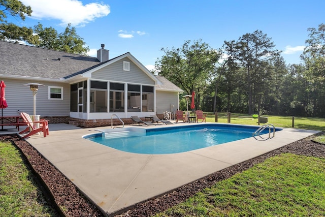 1094 Paul Thompson Rd, Monticello, FL 32344 - swimming pool featuring a sunroom, a patio, and a yard
