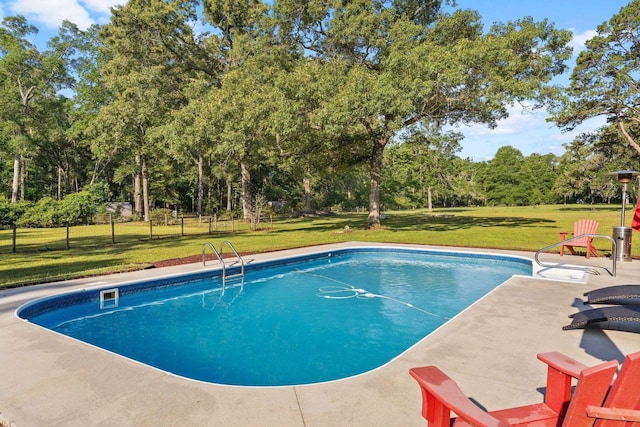 1094 Paul Thompson Rd, Monticello, FL 32344 - outdoor pool with view of wooded area and a patio area