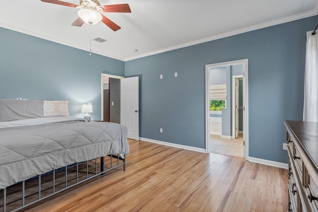 1094 Paul Thompson Rd, Monticello, FL 32344 - bedroom with crown molding, light wood finished floors, baseboards, ceiling fan, and connected bathroom