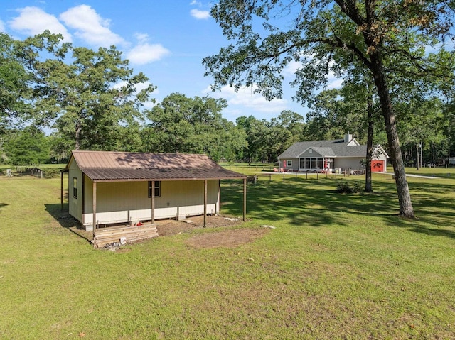 1094 Paul Thompson Rd, Monticello, FL 32344 - view of green lawn with view of wooded area and an outdoor structure